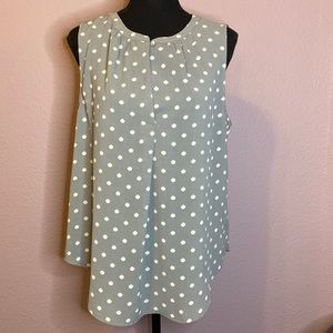 Grey sleeveless blouse with white polka dots